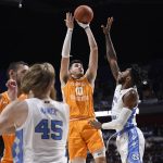 
              Tennessee's John Fulkerson (10) shoots over North Carolina's Caleb Love (2) in the first half of an NCAA college basketball game, Sunday, Nov. 21, 2021, in Uncasville, Conn. (AP Photo/Jessica Hill)
            