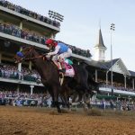 
              FILE - John Velazquez rides Medina Spirit across the finish line to win the 147th running of the Kentucky Derby at Churchill Downs in Louisville, Ky., Saturday, May 1, 2021. Medina Spirit, controversial winner of the Kentucky Derby, and Belmont Stakes winner Essential Quality head a field of 10 horses for the Breeders’ Cup Classic. (AP Photo/Jeff Roberson, File)
            