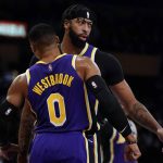 
              Los Angeles Lakers guard Russell Westbrook (0) and forward Anthony Davis (3) celebrate after scoring during the first half of an NBA basketball game against the Miami Heat in Los Angeles, Wednesday, Nov. 10, 2021. (AP Photo/Ashley Landis)
            