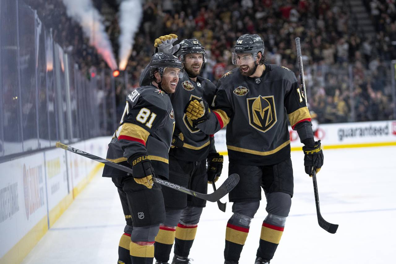 Las Vegas Golden Knights center Jonathan Marchessault (81) celebrates his goal with Shea Theodore (...