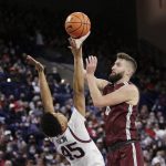 
              Bellarmine forward Ethan Claycomb, right, shoots over Gonzaga guard Rasir Bolton during the first half of an NCAA college basketball game Friday, Nov. 19, 2021, in Spokane, Wash. (AP Photo/Young Kwak)
            