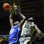 
              Indiana State forward Dearon Tucker (35) and Purdue forward Trevion Williams (50) go up for a rebound during the first half of an NCAA college basketball game in West Lafayette, Ind., Friday, Nov. 12, 2021. (AP Photo/Michael Conroy)
            