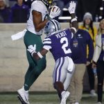 
              Baylor tight end Drake Dabney, left, catches a pass for a touchdown as Kansas State defensive back Russ Yeast, right, defends during the first half of an NCAA college football game on Saturday, Nov. 20, 2021 in Manhattan, Kan. (AP Photo/Colin E. Braley)
            