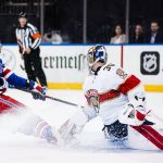 
              New York Rangers' K'Andre Miller (79) shoots the puck past Florida Panthers goaltender Spencer Knight (30) for a goal during the second period of an NHL hockey game Monday, Nov. 8, 2021, in Newark, N.J. (AP Photo/Frank Franklin II)
            
