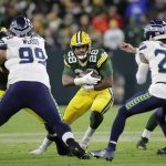 
              Green Bay Packers' AJ Dillon runs during the first half of an NFL football game against the Seattle Seahawks Sunday, Nov. 14, 2021, in Green Bay, Wis. (AP Photo/Aaron Gash)
            