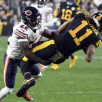 
              Pittsburgh Steelers wide receiver Chase Claypool (11) is tackled by Chicago Bears cornerback Kindle Vildor (22) after making a catch during the first half an NFL football game, Monday, Nov. 8, 2021, in Pittsburgh. (AP Photo/Fred Vuich)
            
