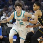 
              Charlotte Hornets guard LaMelo Ball (2) drives to the basket against Golden State Warriors guard Jordan Poole during the first half of an NBA basketball game in San Francisco, Wednesday, Nov. 3, 2021. (AP Photo/Jeff Chiu)
            