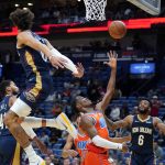
              Oklahoma City Thunder guard Shai Gilgeous-Alexander goes to the basket against New Orleans Pelicans center Jaxson Hayes, left, and guard Nickeil Alexander-Walker (6) in the first half of an NBA basketball game in New Orleans, Wednesday, Nov. 10, 2021. (AP Photo/Gerald Herbert)
            