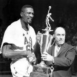 
              FILE - Boston Celtics player Bill Russell receives "Player of the Year" award from National Basketball Association Commission Walter Kennedy during halftime of the All-Stars game at Boston Garden on Jan. 14, 1964. (AP Photo/File)
            