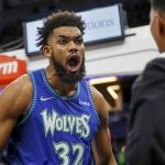 
              After scoring a basket and drawing a foul against the Phoenix Suns, Minnesota Timberwolves center Karl-Anthony Towns yells to a fan in the fourth quarter of an NBA basketball game Monday, Nov. 15, 2021, in Minneapolis. (AP Photo/Bruce Kluckhohn)
            