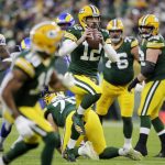 
              Green Bay Packers' Aaron Rodgers runs during the first half of an NFL football game against the Los Angeles Rams Sunday, Nov. 28, 2021, in Green Bay, Wis. (AP Photo/Aaron Gash)
            
