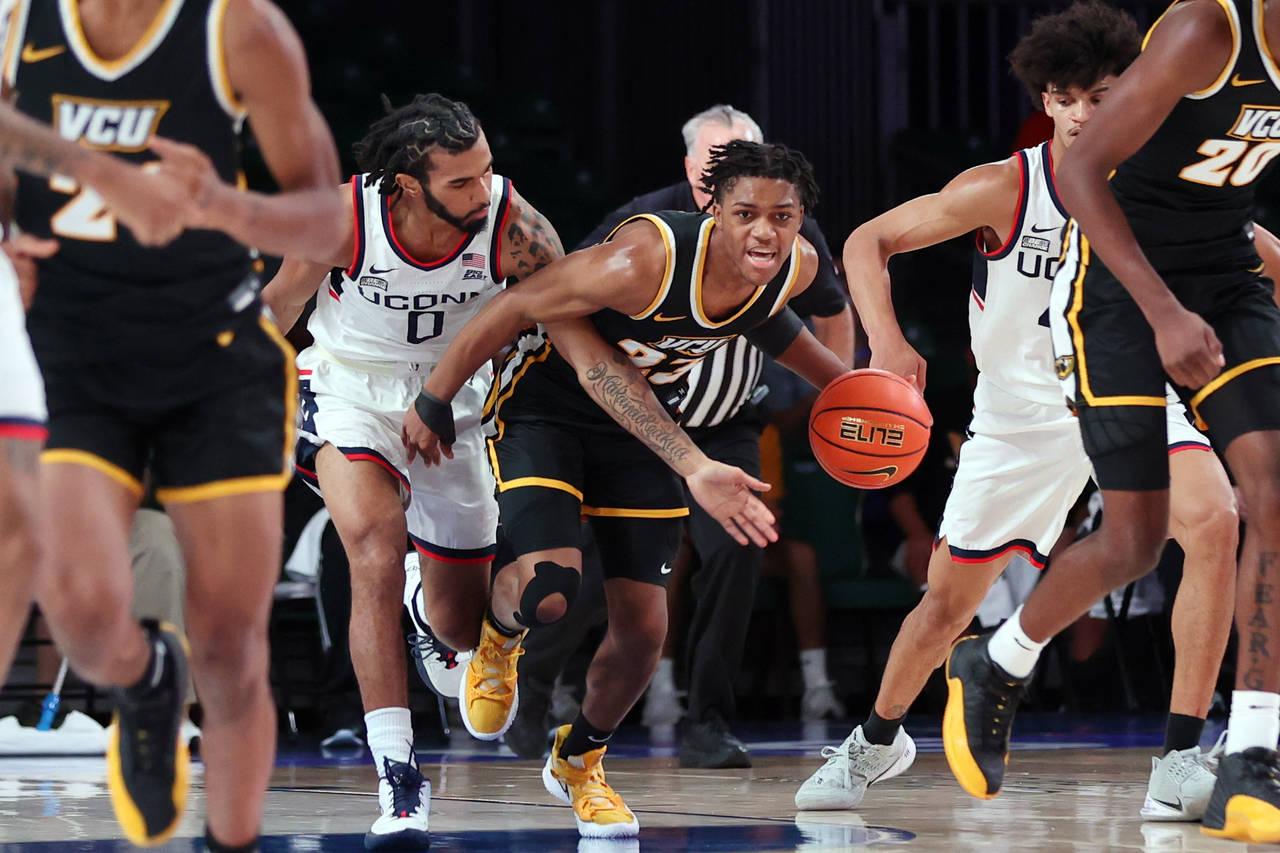 In this photo provided by Bahamas Visual Services, VCU guard Jayden Nunn (23) brings the ball up co...