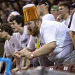 
              St. Bonaventure fan Dominic Grecco also known as 'Captain Beer' cheers during an NCAA college basketball game against Boise State at the Charleston Classic in Charleston, S.C., Thursday, Nov. 18, 2021. (Andrew J. Whitaker/The Post And Courier via AP)
            