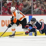 
              Philadelphia Flyers center Sean Couturier, left, and Washington Capitals right wing Tom Wilson chase after a puck in the third period of an NHL hockey game, Saturday, Nov. 6, 2021, in Washington. (AP Photo/Patrick Semansky)
            