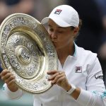 
              FILE - Australia's Ashleigh Barty poses with the trophy for the media after winning the women's singles final after defeating the Czech Republic's Karolina Pliskova on day twelve of the Wimbledon Tennis Championships in London, Saturday, July 10, 2021. Wimbledon champion Ash Barty finished No. 1 in the WTA singles rankings for the third consecutive season, while Katerina Siniakova topped the doubles rankings for the second time. Barty, a 25-year-old from Australia, joins Serena Williams, Steffi Graf, Martina Navratilova and Chris Evert as the only women to lead the year-end tennis rankings three straight times. (Pete Nichols/Pool via AP, File)
            