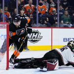 
              Philadelphia Flyers' Rasmus Ristolainen, left, cannot get a shot past Arizona Coyotes' Karel Vejmelka during the second period of an NHL hockey game, Tuesday, Nov. 2, 2021, in Philadelphia. (AP Photo/Matt Slocum)
            