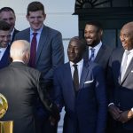
              President Joe Biden talks with members of the Milwaukee Bucks basketball team during an event to celebrate their 2021 NBA Championship, on the South Lawn of the White House in Washington, Monday, Nov. 8, 2021. (AP Photo/Susan Walsh)
            