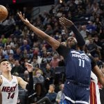 
              Minnesota Timberwolves center Naz Reid (11) reaches for a rebound as Miami Heat guard Tyler Herro (14) looks to catch it during the first half of an NBA basketball game Wednesday, Nov. 24, 2021, in Minneapolis. (AP Photo/Craig Lassig)
            