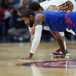 
              LA Clippers guard Paul George chases down a loose ball with New Orleans Pelicans guard Josh Hart in the first half of an NBA basketball game in New Orleans, Friday, Nov. 19, 2021. (AP Photo/Gerald Herbert)
            
