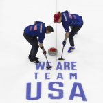 
              Team Shuster's John Landsteiner, left, and Matt Hamilton sweep to curl the rock while competing against Team Dropkin during the third night of finals at the U.S. Olympic Curling Team Trials at Baxter Arena in Omaha, Neb., Sunday, Nov. 21, 2021. (AP Photo/Rebecca S. Gratz)
            
