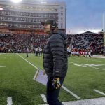 
              Michigan head coach Jim Harbaugh looks on during the first half of an NCAA college football game against Maryland, Saturday, Nov. 20, 2021, in College Park, Md. (AP Photo/Julio Cortez)
            