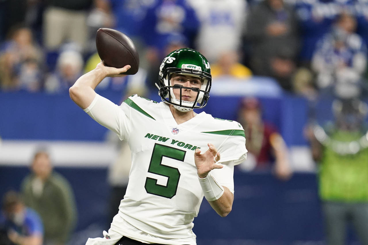 New York Jets quarterback Mike White (5) throws during the first half of an NFL football game again...