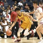 
              Southern California forward Max Agbonkpolo drives to the basket past Saint Joseph's forward Taylor Funk (33) in the first half of an NCAA college basketball game at the Wooden Legacy tournament in Anaheim, Calif., Thursday, Nov. 25, 2021. (AP Photo/Jayne Kamin-Oncea)
            