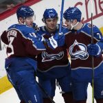 
              Colorado Avalanche right wing Valeri Nichushkin, left, celebrates his goal with defensemen Samuel Girard and Devon Toews, right, during the first period of an NHL hockey game against the Vancouver Canucks on Thursday, Nov. 11, 2021, in Denver. (AP Photo/David Zalubowski)
            