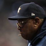
              Houston Astros manager Dusty Baker Jr. watches with a toothpick in his mouth during the third inning in Game 5 of baseball's World Series between the Houston Astros and the Atlanta Braves Sunday, Oct. 31, 2021, in Atlanta. (AP Photo/David J. Phillip)
            