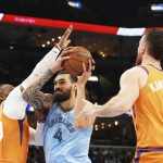 
              Phoenix Suns' Jae Crowder (99) blocks Memphis Grizzlies' Steven Adams (4) in the first half of an NBA basketball game Friday, Nov. 12, 2021, in Memphis, Tenn. (AP Photo/Karen Pulfer Focht)
            