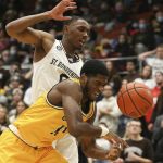 
              Canisius guard Armon Harried (11) loses the ball as he's fouled by St. Bonaventure guard Kyle Lofton (0) during the first half of an NCAA college basketball game Sunday, Nov. 14, 2021, in Olean, N.Y. (AP Photo/Joshua Bessex)
            