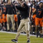 
              Oklahoma State coach Mike Gundy gestures during the second half of the team's NCAA college football game against Oklahoma, Saturday, Nov. 27, 2021, in Stillwater, Okla. (AP Photo/Sue Ogrocki)
            