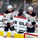 
              Edmonton Oilers center Leon Draisaitl (29) celebrates his goal against the Arizona Coyotes with Oilers center Connor McDavid (97) during the second period of an NHL hockey game Wednesday, Nov. 24, 2021, in Glendale, Ariz. (AP Photo/Ross D. Franklin)
            