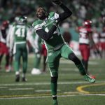
              Saskatchewan Roughriders wide receiver D'haquille Williams (14) celebrates after the team's win over the Calgary Stampeders during overtime in a CFL football game Sunday, Nov. 28., 2021 in Regina, Saskatchewan. (Kayle Neis/The Canadian Press via AP)
            