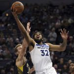 
              Minnesota Timberwolves center Karl-Anthony Towns (32) shoots the ball against Indiana Pacers forward Domantas Sabonis (11) during the first half of an NBA basketball game Monday, Nov. 29, 2021, in Minneapolis. (AP Photo/Stacy Bengs)
            