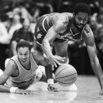 
              FILE - New Jersey Nets Len Elmore, right, trips over downed Cleveland Cavalier Geoff Huston as they both chased a loose ball in an NBA game Nov 6, 1982, in the Richfield Coliseum in Akron, Ohio. The Nets handed the Cavaliers their 24th straight loss. (AP Photo/Mark Duncan, File)
            