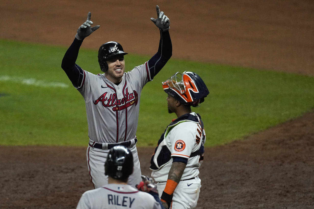Atlanta Braves' Freddie Freeman celebrates after a home run during the seventh inning in Game 6 of ...