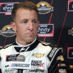 
              AJ Allmendinger speaks during media day ahead of Saturday's NASCAR Xfinity Cup Series championship auto race Thursday, Nov. 4, 2021, in Phoenix. (AP Photo/Rick Scuteri)
            