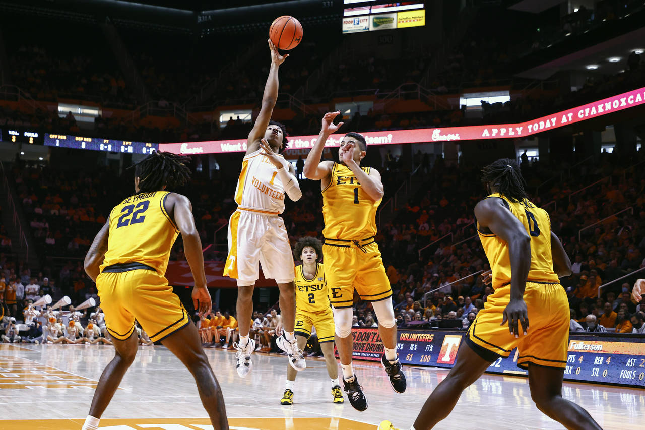 Tennessee guard Kennedy Chandler (1) shoots past East Tennessee State guard Mohab Yasser (1) during...