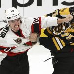 
              Ottawa Senators' Alex Formenton fights with Boston Bruins' Connor Clifton during the second period of an NHL hockey game Tuesday, Nov. 9, 2021, in Boston. (AP Photo/Winslow Townson)
            