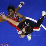
              Philadelphia 76ers' Tyrese Maxey, left, tries to get a shot past Portland Trail Blazers' Jusuf Nurkic during the first half of an NBA basketball game, Monday, Nov. 1, 2021, in Philadelphia. (AP Photo/Matt Slocum)
            