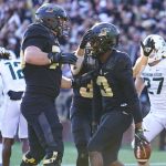 
              Purdue wide receiver David Bell (3) celebrates a touchdown with offensive lineman Spencer Holstege (75) during the first half of an NCAA college football game against Michigan State in West Lafayette, Ind., Saturday, Nov. 6, 2021. (AP Photo/Michael Conroy)
            