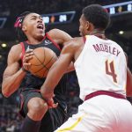 
              Toronto Raptors forward Scottie Barnes (4) drives to the basket against Cleveland Cavaliers center Evan Mobley (4) during first-half NBA basketball game action in Toronto, Friday, Nov. 5, 2021. (Evan Buhler/The Canadian Press via AP)
            