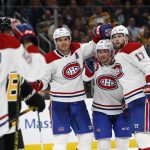 
              Montreal Canadiens' Josh Anderson (17), Adam Brooks, center, and Ben Chiarot celebrate a goal credited to Michael Pezzetta during the second period of an NHL hockey game against the Boston Bruins, Sunday, Nov. 14, 2021, in Boston. (AP Photo/Winslow Townson)
            