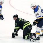 
              St. Louis Blues' Torey Krug (47) and Ryan O'Reilly (90) look on as Dallas Stars' Luke Glendening (11) attempts to stand up after suffering an unknown injury in the third period of an NHL hockey game in Dallas, Saturday, Nov. 20, 2021. (AP Photo/Tony Gutierrez)
            