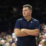 
              Arizona coach Tommy Lloyd watches during the first half of the team's NCAA college basketball game against Northern Arizona, Tuesday, Nov. 9, 2021, in Tucson, Ariz. (AP Photo/Rick Scuteri)
            