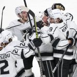 
              Los Angeles Kings' Adrian Kempe (9) celebrates with teammates after scoring the game-winning goal against the Montreal Canadiens during overtime in NHL hockey game Tuesday, Nov. 9, 2021, in Montreal. (Paul Chiasson/The Canadian Press via AP)
            