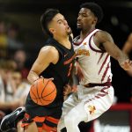 
              Oregon State guard Jarod Lucas (2) is fouled by Iowa State guard Izaiah Brockington, right, during the first half of an NCAA college basketball game, Friday, Nov. 12, 2021, in Ames, Iowa. (AP Photo/Charlie Neibergall)
            
