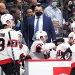 
              Ottawa Senators coach DJ Smith, center, talks with players during the second period of the team's NHL hockey game against the Colorado Avalanche on Monday, Nov. 22, 2021, in Denver. (AP Photo/David Zalubowski)
            