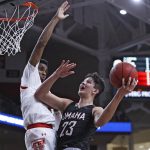 
              Omaha's Frankie Fidler (23) shoots as Texas Tech's Mylik Wilson defends during the first half of an NCAA college basketball game Tuesday, Nov. 23, 2021, in Lubbock, Texas. (Brad Tollefson/Lubbock Avalanche-Journal via AP)
            
